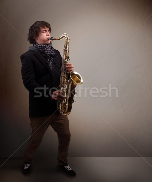 Jonge muzikant spelen saxofoon knap muziek Stockfoto © ra2studio