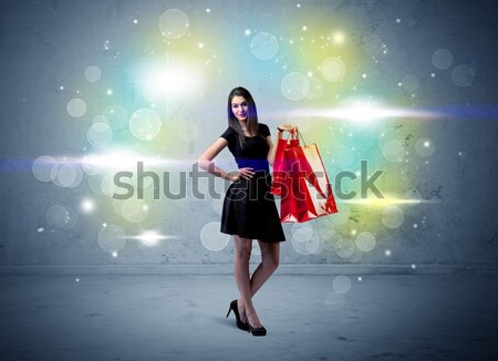 Mall lady with shopping bags and glitter light Stock photo © ra2studio