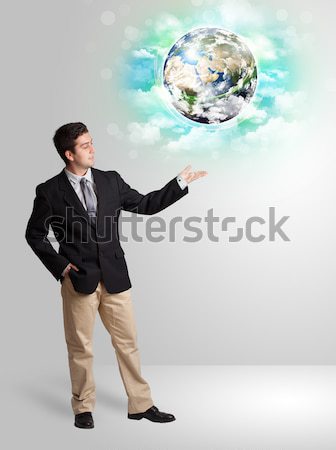 Businesswoman on rock mountain with a globe Stock photo © ra2studio