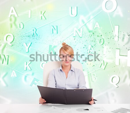 Business woman at desk with green word cloud Stock photo © ra2studio