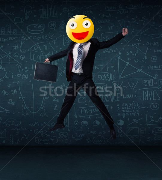 Stock photo: businessman wears yellow smiley face