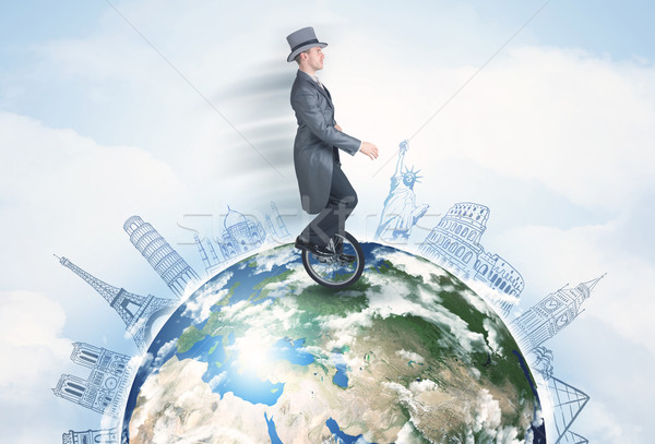 человека верховая езда одноколесном велосипеде вокруг мира Сток-фото © ra2studio