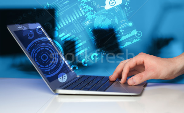 Stock photo: Modern notebook computer with future technology symbols