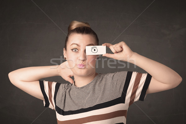 Funny woman looking with hand drawn paper eyes Stock photo © ra2studio