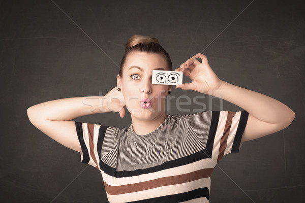 Funny woman looking with hand drawn paper eyes Stock photo © ra2studio