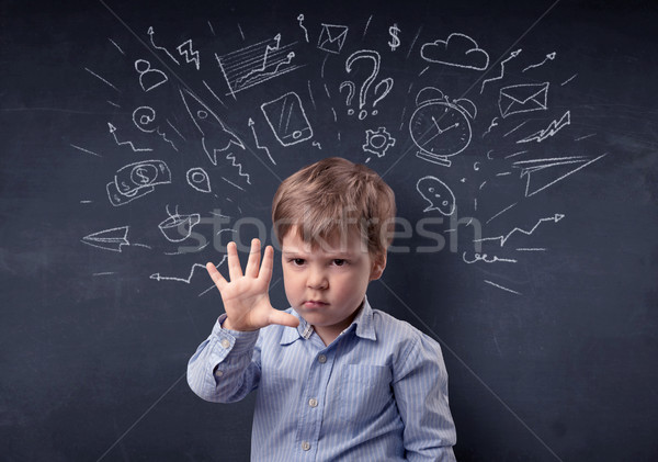 Little boy in front of a drawn up blackboard Stock photo © ra2studio