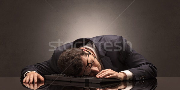 Businessman fell asleep at his workplace Stock photo © ra2studio