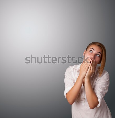 Stock photo: Young woman making gestures 