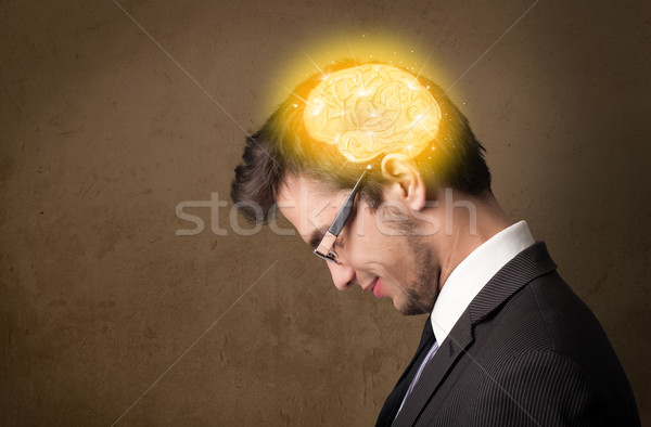 Young man thinking with glowing brain illustration Stock photo © ra2studio