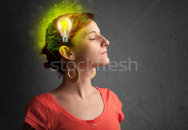 Young mind thinking of green eco energy with lightbulb Stock photo © ra2studio