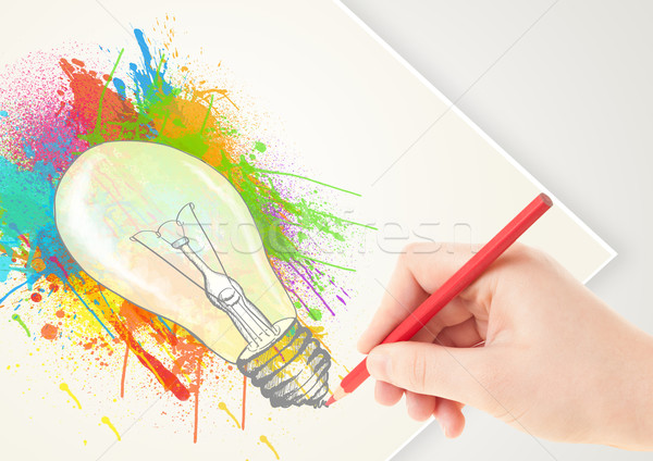 Hand drawing on paper a colorful splatter lightbulb  Stock photo © ra2studio