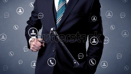 Businessman pressing imaginary button Stock photo © ra2studio