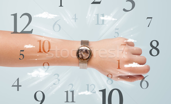 Hand with watch and numbers on the side comming out Stock photo © ra2studio