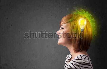 Young mind thinking of green eco energy with lightbulb Stock photo © ra2studio