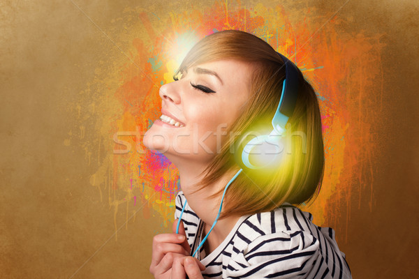 Young woman with headphones listening to music Stock photo © ra2studio