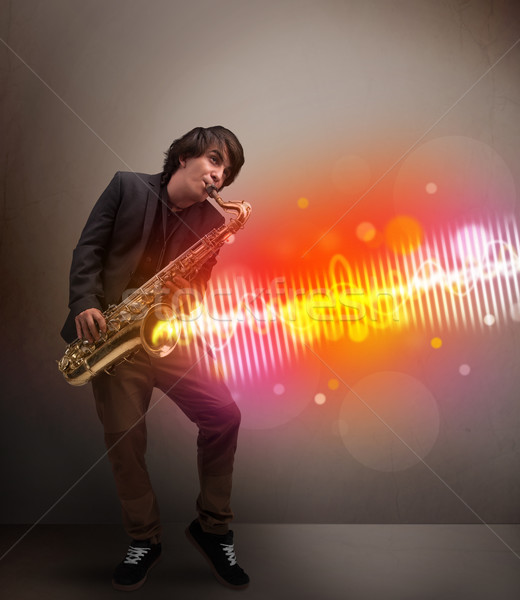 Stock foto: Junger · Mann · spielen · Saxophon · farbenreich · Sound · Wellen