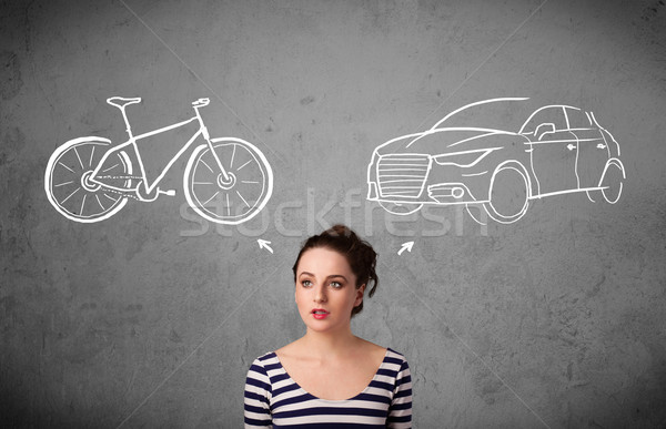 Woman making a choice between bicycle and car Stock photo © ra2studio