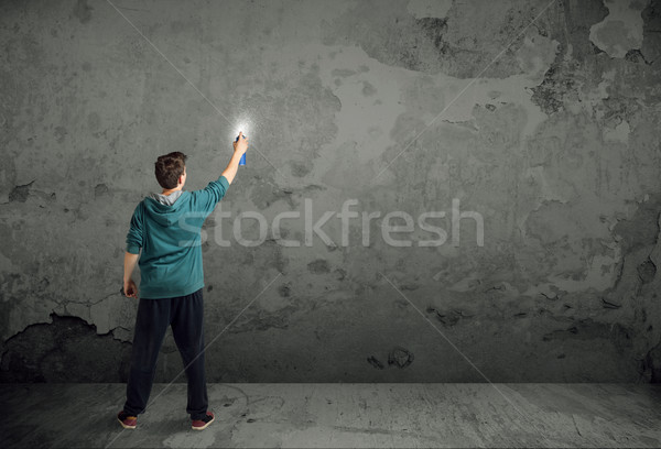 Young urban painter starting to draw Stock photo © ra2studio