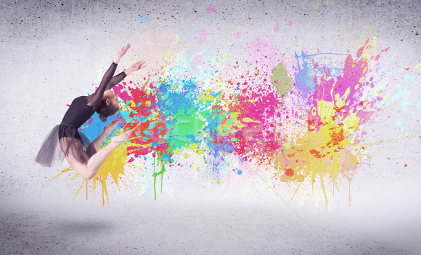 Modern street dancer jumping with colorful paint splashes Stock photo © ra2studio