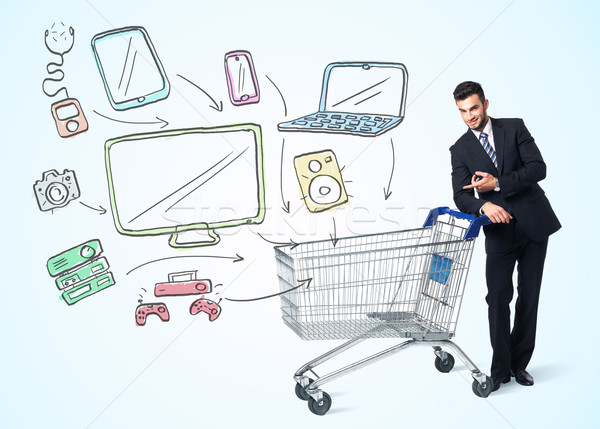 Businessman with shopping cart Stock photo © ra2studio