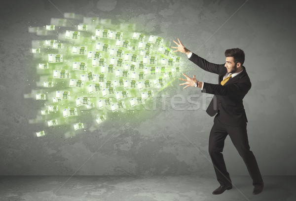 Young business person throwing money concept Stock photo © ra2studio