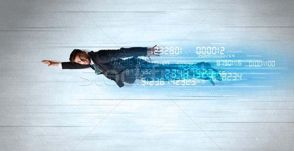 Businessman flying super fast with data numbers left behind Stock photo © ra2studio