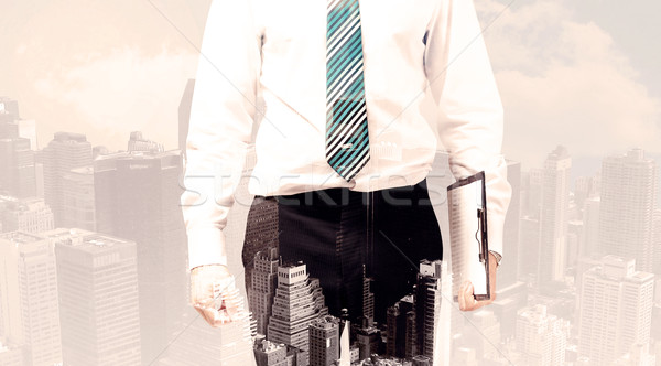 Handsome business man with overlay cityscape Stock photo © ra2studio