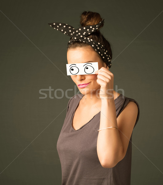 Young silly girl looking with hand drawn eye balls on paper Stock photo © ra2studio