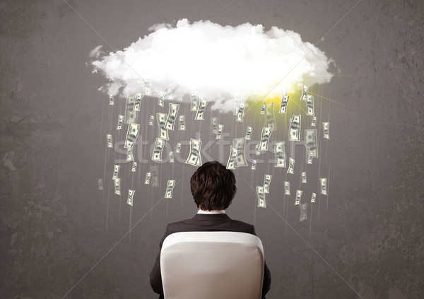 Business man in suit looking at cloud with falling money Stock photo © ra2studio