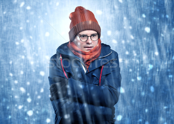 Handsome boy shivering at snowstorm concept Stock photo © ra2studio