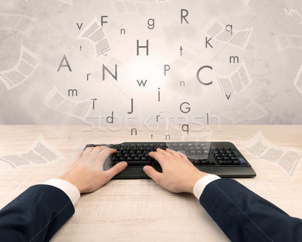 Elegant businessman hand typing with fluttering papers around Stock photo © ra2studio