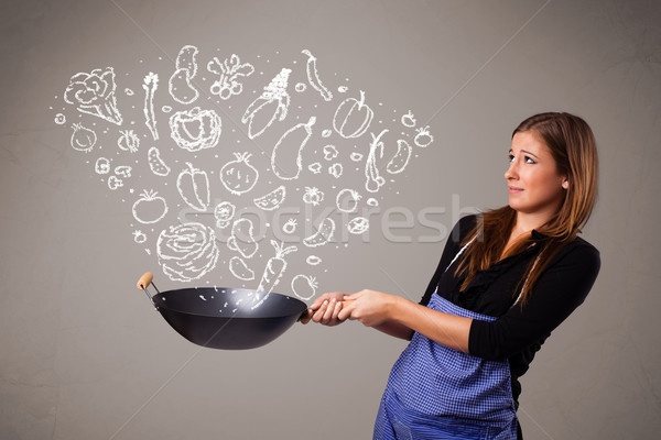 Woman cooking vegetables Stock photo © ra2studio