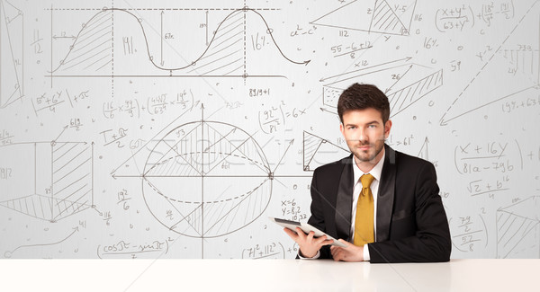 Businessman with business calculations background Stock photo © ra2studio