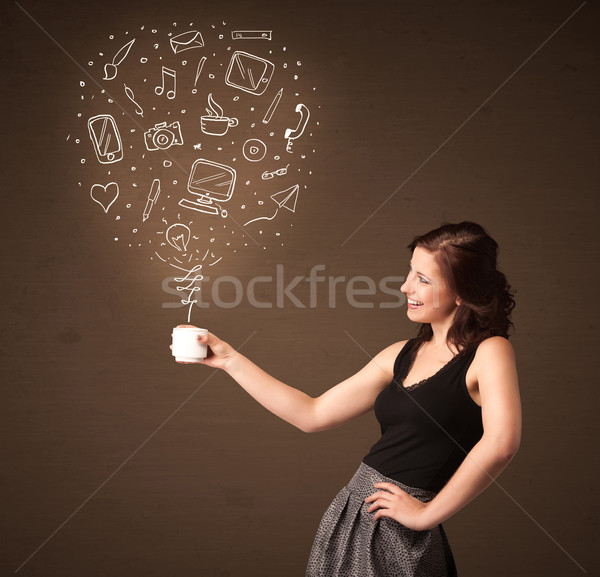 Businesswoman holding a white cup with social media icons Stock photo © ra2studio