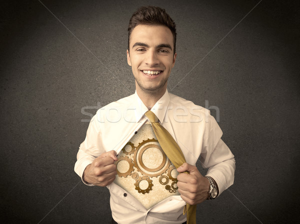 Businessman tearing shirt off and machine cog wheel shows Stock photo © ra2studio