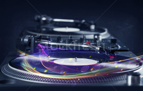 Turntable playing vinyl with glowing abstract lines Stock photo © ra2studio