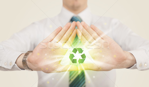 Mains forme recyclage signe vert centre [[stock_photo]] © ra2studio
