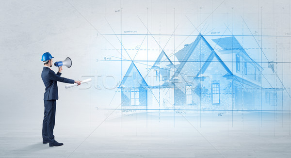 Architect standing with house plan Stock photo © ra2studio