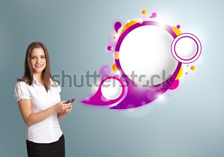 attractive young woman holding a laptop and presenting abstract speech bubble copy space Stock photo © ra2studio