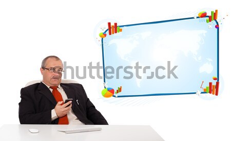 businessman sitting at desk and holding a mobilephone, isolated on white Stock photo © ra2studio