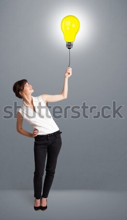Joli dame ampoule ballon jeune femme [[stock_photo]] © ra2studio
