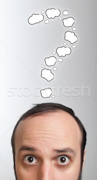 Young guy with question mark over his head Stock photo © ra2studio