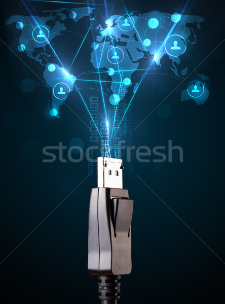 Social network icons coming out of electric cable Stock photo © ra2studio