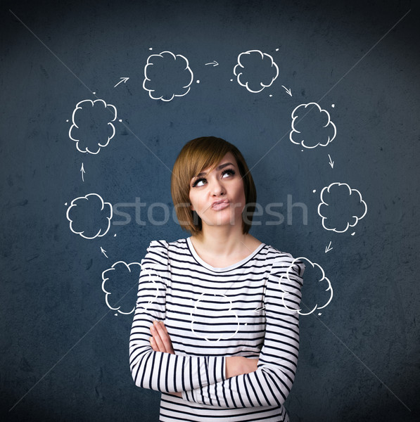 Young woman thinking with cloud circulation around her head Stock photo © ra2studio