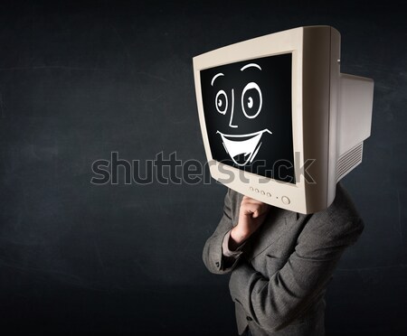 Happy businessman with a PC monitor head and a smiley face Stock photo © ra2studio