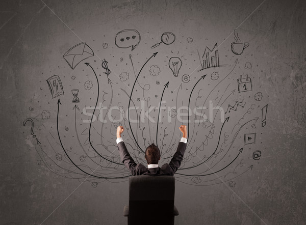 Businessman in front of a chalkboard deciding with arrows and si Stock photo © ra2studio