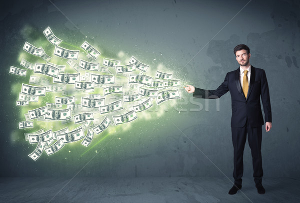 Business person throwing a lot of dollar bills concept Stock photo © ra2studio