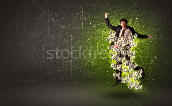 Cheerful businesman jumping with dollar banknotes around him Stock photo © ra2studio