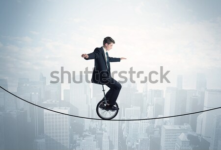Enérgico homem de negócios saltando ponte lacuna céu Foto stock © ra2studio