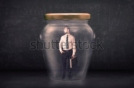 Business man closed into a glass jar concept Stock photo © ra2studio